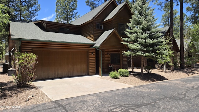 3024 Buck Crossing Way, Pinetop, AZ 85935 - view of front of home with a garage, roof with shingles, and concrete driveway