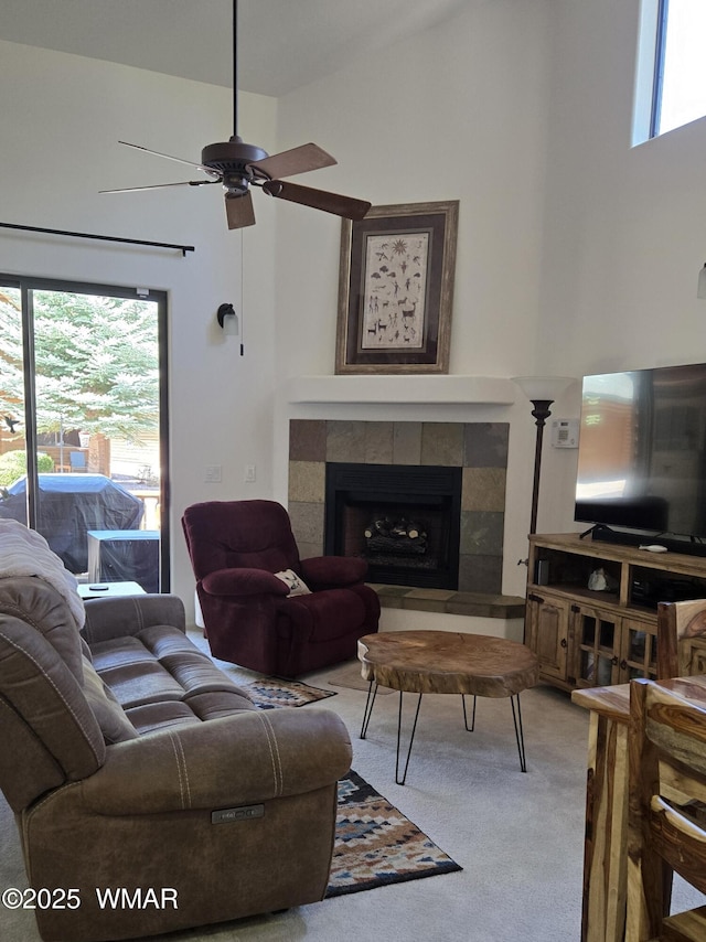 3024 Buck Crossing Way, Pinetop, AZ 85935 - carpeted living area featuring plenty of natural light, ceiling fan, a tiled fireplace, and a towering ceiling