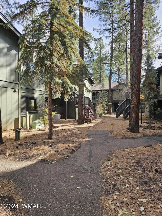 2844 Park Cir Unit 36A, Pinetop, AZ 85935 - view of side of property featuring stairway and a wooden deck
