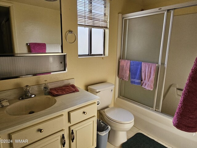 2844 Park Cir Unit 36A, Pinetop, AZ 85935 - full bathroom with toilet, shower / bath combination with glass door, and vanity