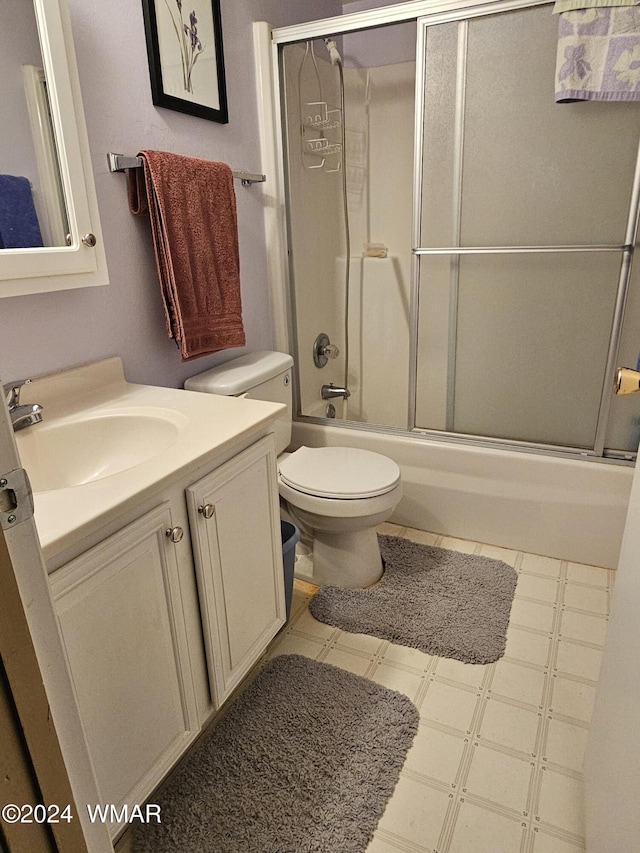 2844 Park Cir Unit 36A, Pinetop, AZ 85935 - bathroom with enclosed tub / shower combo, vanity, toilet, and tile patterned floors