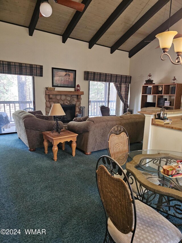 2844 Park Cir Unit 36A, Pinetop, AZ 85935 - living room with a stone fireplace, carpet flooring, beam ceiling, and a healthy amount of sunlight