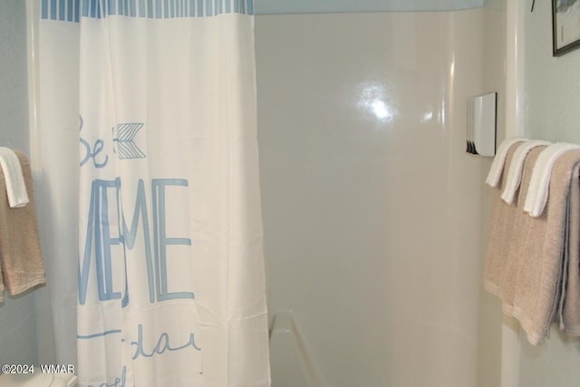 bathroom with a shower with curtain