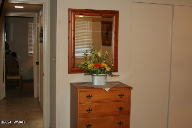 hallway with tile patterned flooring