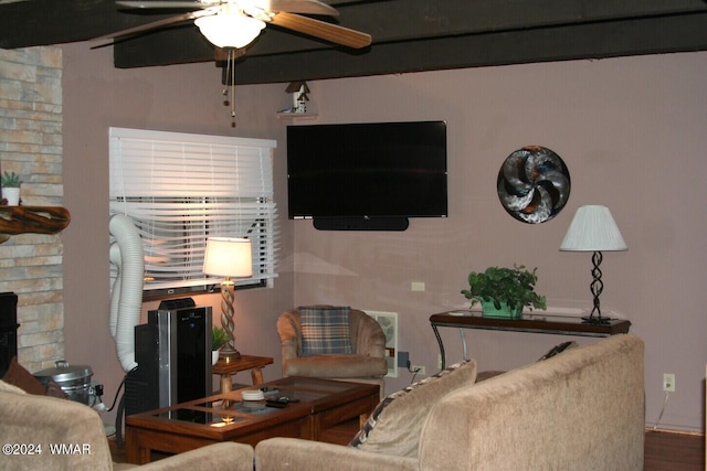 living area featuring a ceiling fan