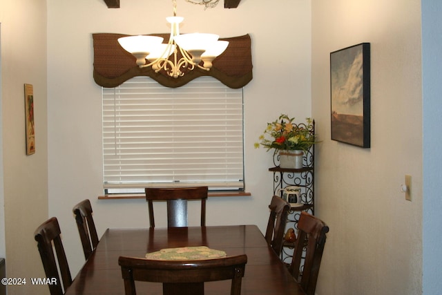 dining area featuring a notable chandelier