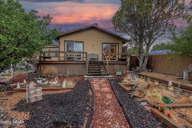 2045 Silver Creek Dr, Show Low, AZ 85901 - rear view of property with a vegetable garden, a fenced backyard, a wooden deck, and stairs