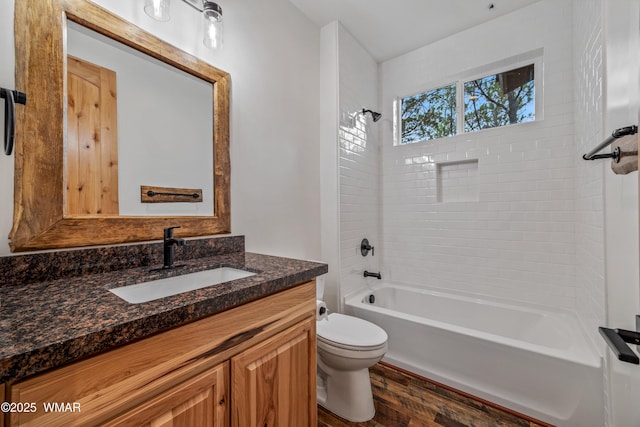 2759 Panther Cir, Overgaard, AZ 85933 - bathroom featuring vanity, toilet, bathtub / shower combination, and wood finished floors
