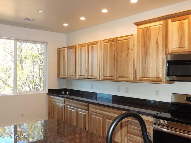 2759 Panther Cir, Overgaard, AZ 85933 - kitchen with appliances with stainless steel finishes, recessed lighting, and dark stone counters