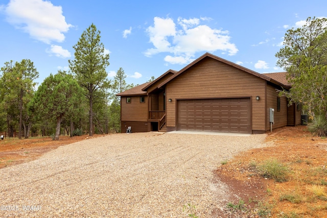 2759 Panther Cir, Overgaard, AZ 85933 - rustic home with driveway and a garage