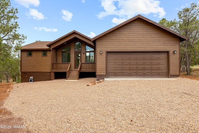 2759 Panther Cir, Overgaard, AZ 85933 - chalet / cabin featuring driveway, an attached garage, and a deck