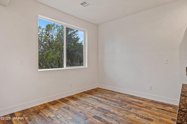 2759 Panther Cir, Overgaard, AZ 85933 - spare room featuring baseboards and wood finished floors