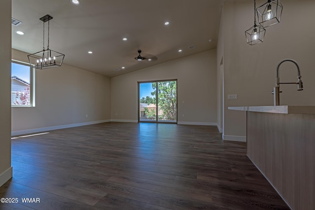 840 E Blue Jay Ln, Show Low, AZ 85901 - unfurnished dining area featuring dark wood-style floors, vaulted ceiling, recessed lighting, and a chandelier