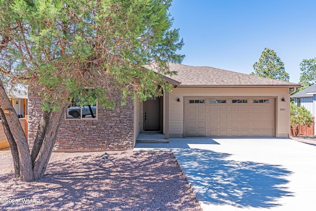 840 E Blue Jay Ln, Show Low, AZ 85901 - single story home with driveway, stone siding, and a garage