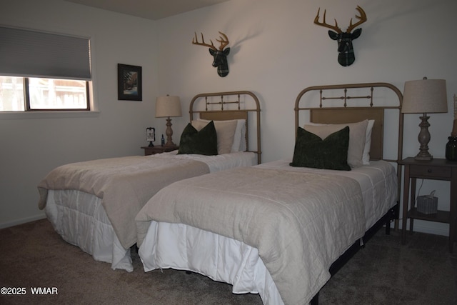 carpeted bedroom featuring baseboards
