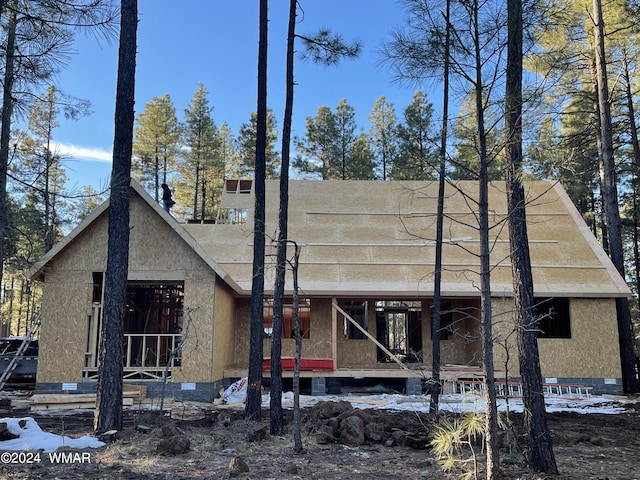 view of front facade with crawl space and stucco siding