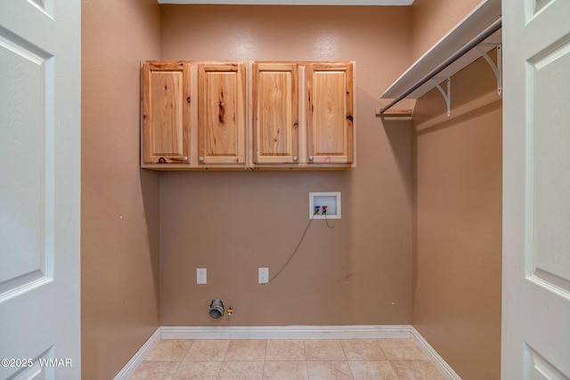 laundry area featuring washer hookup, cabinet space, gas dryer hookup, and baseboards