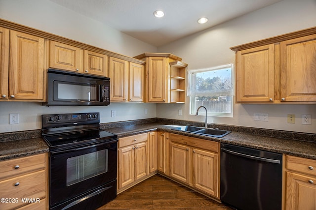 kitchen with recessed lighting, a sink, dark wood-style floors, black appliances, and dark countertops