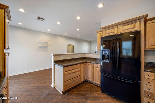 kitchen with a peninsula, black refrigerator with ice dispenser, dark wood finished floors, and recessed lighting