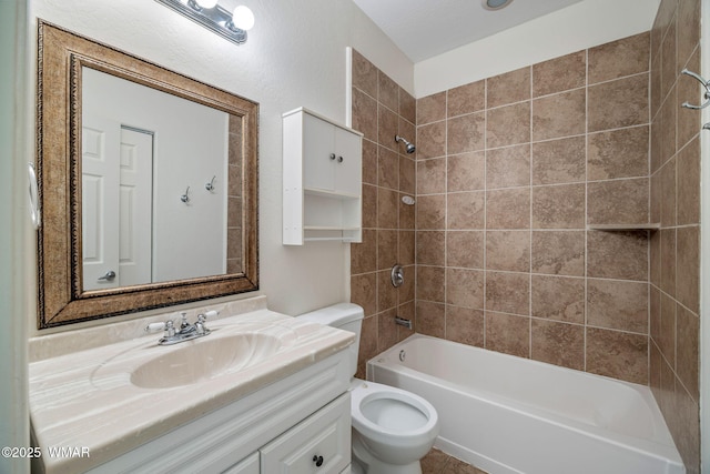 full bathroom featuring toilet, vanity, and bathing tub / shower combination