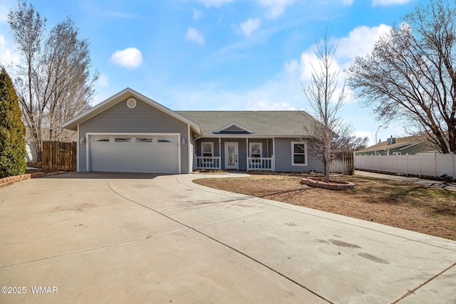 ranch-style home with a porch, fence, driveway, and an attached garage