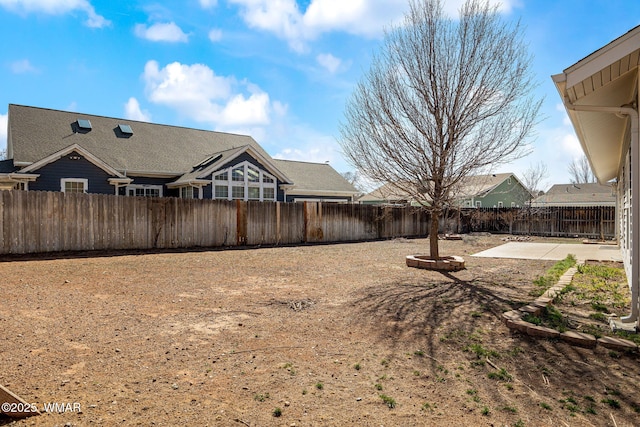 view of yard with a fenced backyard and a patio