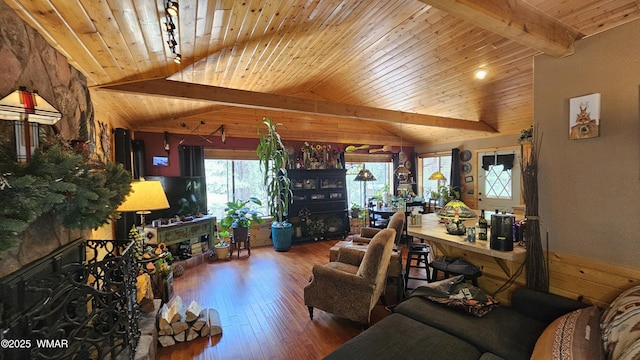 living area featuring wooden ceiling, a fireplace, wood-type flooring, and vaulted ceiling with beams