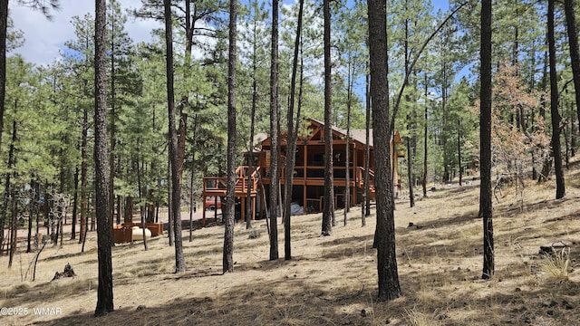 view of outbuilding with a view of trees