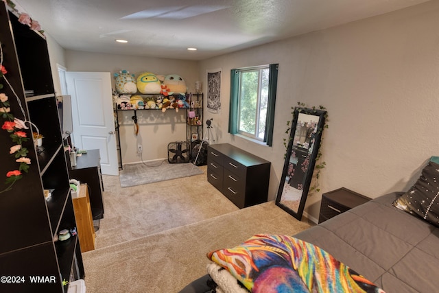 bedroom featuring light carpet