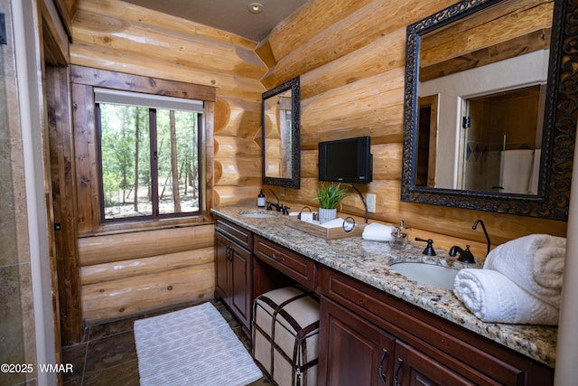 full bathroom with double vanity and a sink