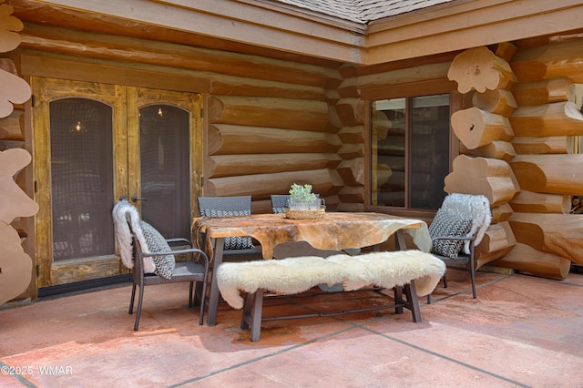 dining space with rustic walls