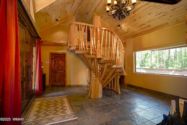 staircase featuring wood ceiling, vaulted ceiling, baseboards, and a chandelier