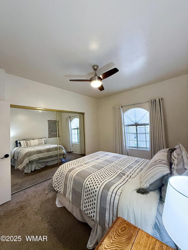 carpeted bedroom featuring a ceiling fan