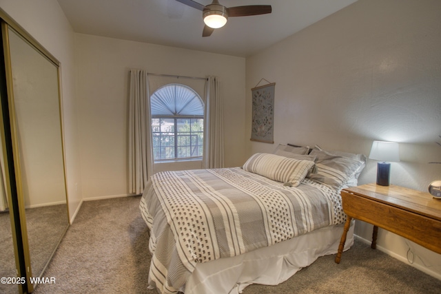 carpeted bedroom with a ceiling fan and baseboards