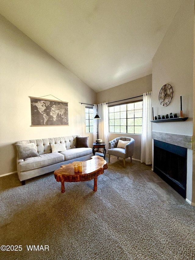 carpeted living area with high vaulted ceiling, a fireplace, and baseboards