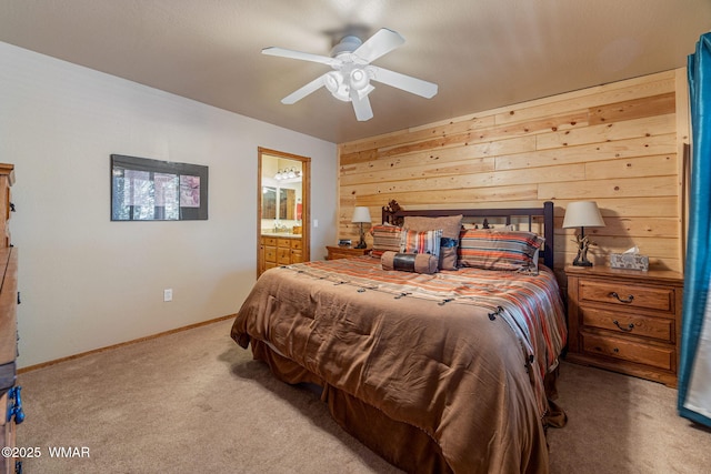 1761 N Bison Ct, Show Low, AZ 85901 - carpeted bedroom featuring wood walls, connected bathroom, and a ceiling fan