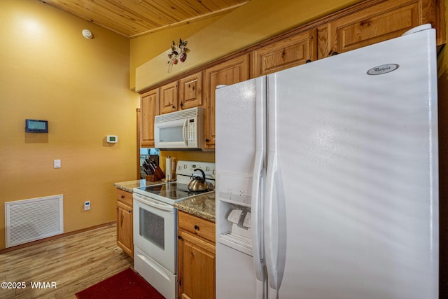 1761 N Bison Ct, Show Low, AZ 85901 - kitchen with white appliances, light wood finished floors, brown cabinets, wooden ceiling, and stone counters