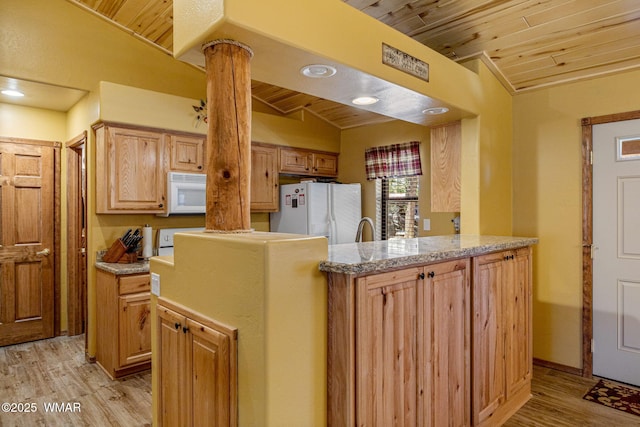 1761 N Bison Ct, Show Low, AZ 85901 - kitchen featuring white appliances, wooden ceiling, light wood finished floors, vaulted ceiling, and light countertops