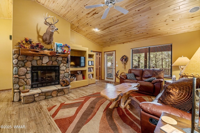1761 N Bison Ct, Show Low, AZ 85901 - living room featuring vaulted ceiling, wooden ceiling, wood finished floors, ceiling fan, and a fireplace
