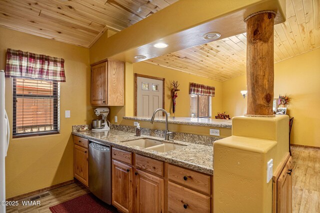 1761 N Bison Ct, Show Low, AZ 85901 - kitchen with stainless steel dishwasher, wood ceiling, light wood finished floors, light stone counters, and a peninsula