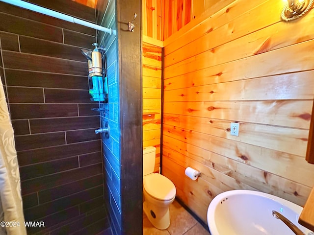 3403 Top View Rd, Overgaard, AZ 85933 - full bathroom with wood walls, toilet, tiled shower, and tile patterned flooring