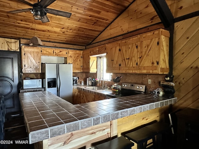 3403 Top View Rd, Overgaard, AZ 85933 - kitchen with tile countertops, refrigerator with ice dispenser, a sink, electric range, and lofted ceiling