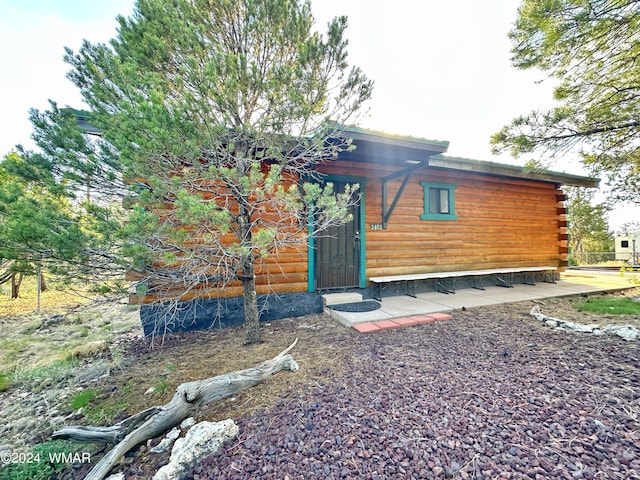 3403 Top View Rd, Overgaard, AZ 85933 - back of house with log exterior