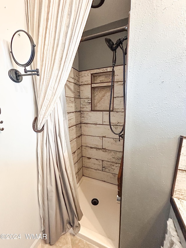 full bathroom with a shower stall