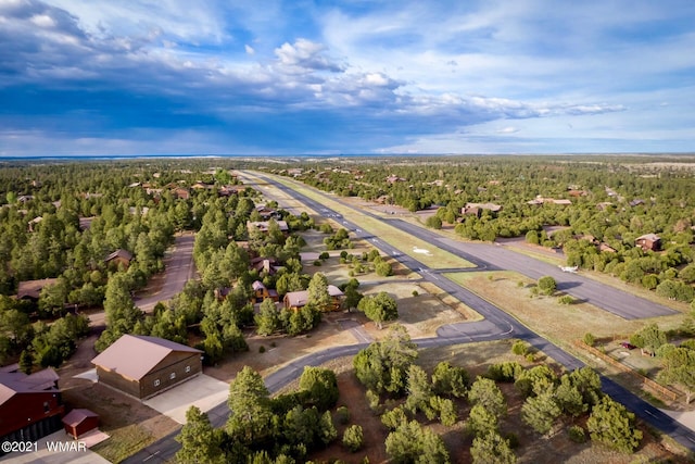 2344 Hellcat Cir, Overgaard, AZ 85933 - aerial view of residential area with a heavily wooded area