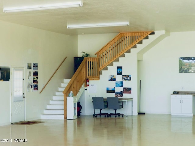 2344 Hellcat Cir, Overgaard, AZ 85933 - stairs featuring a high ceiling and baseboards