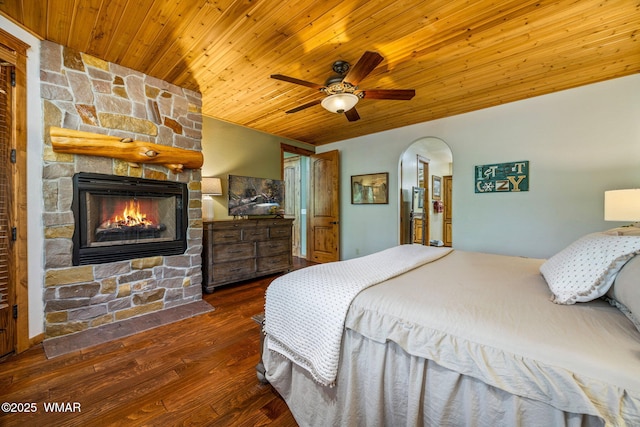 4040 W Ninebark Ln, Show Low, AZ 85901 - bedroom with wooden ceiling, a fireplace, arched walkways, wood finished floors, and ceiling fan