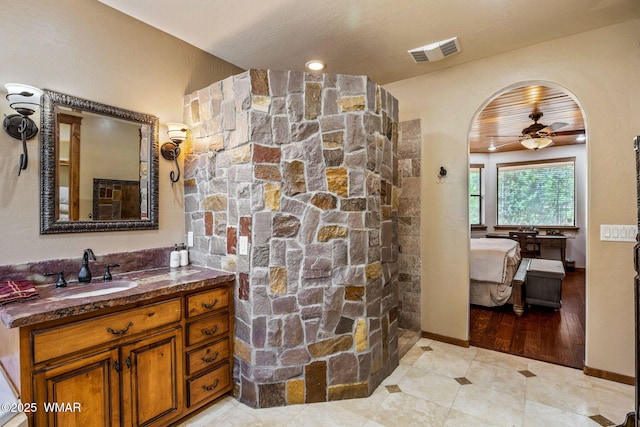 4040 W Ninebark Ln, Show Low, AZ 85901 - bathroom with ensuite bath, vanity, ceiling fan, and a walk in shower