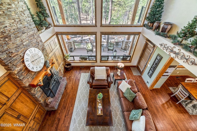 4040 W Ninebark Ln, Show Low, AZ 85901 - living room featuring a towering ceiling, hardwood / wood-style flooring, and plenty of natural light