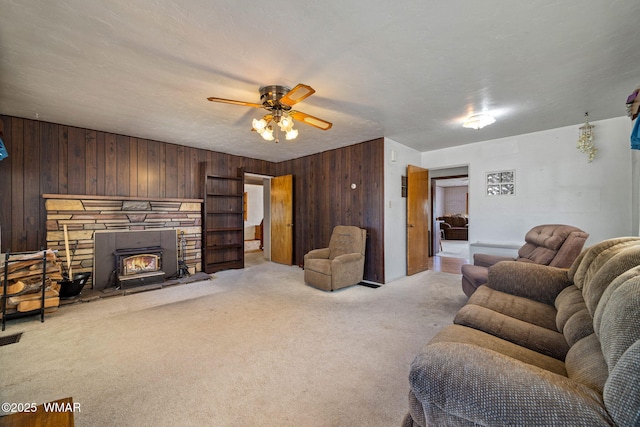 367 S Main St, Eagar, AZ 85925 - living room with wood walls, carpet floors, and ceiling fan